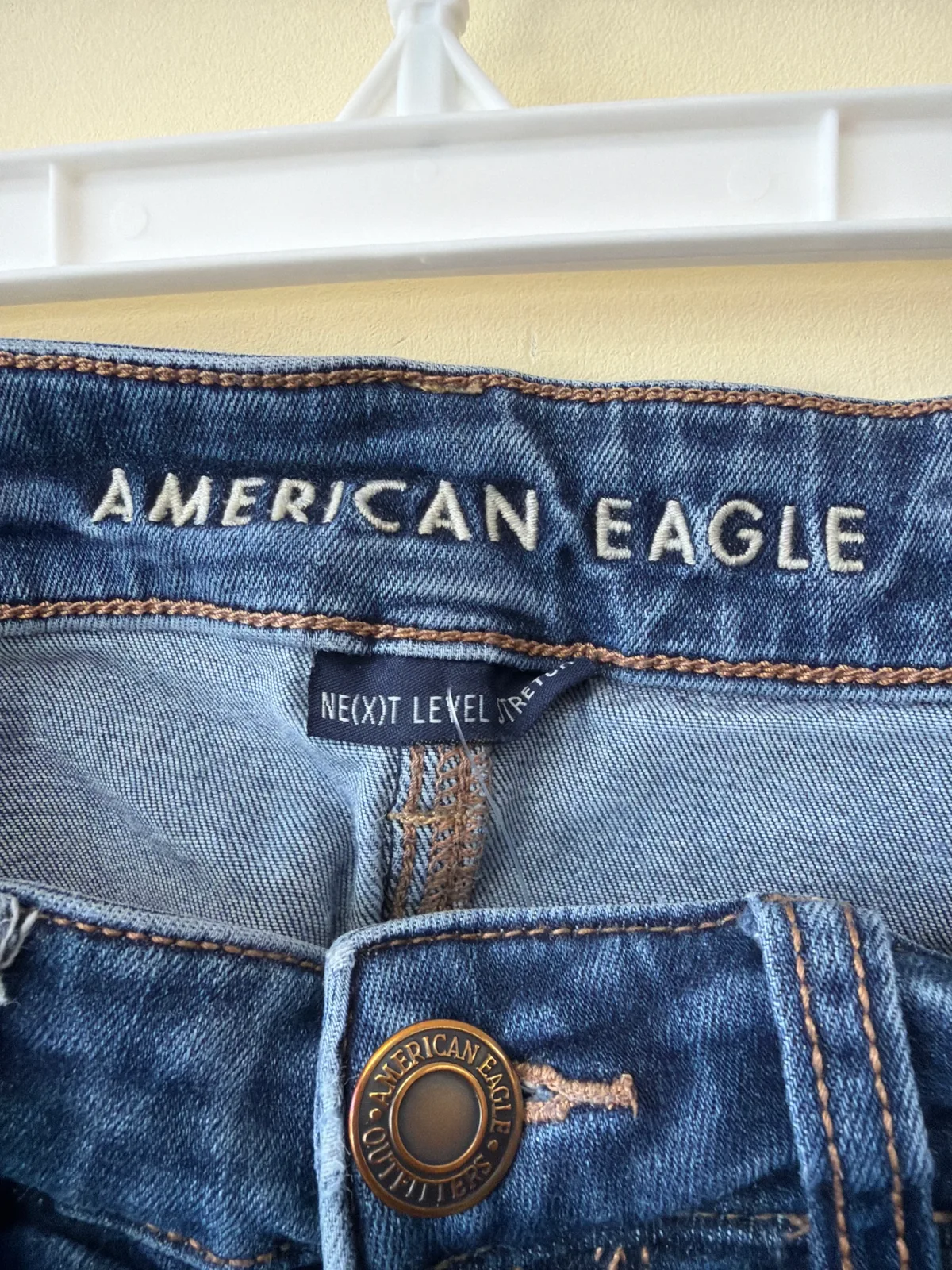 American Eagle Distressed Mid-Rise Skinny Jeans – Medium Wash photo 4